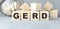 Word GERD Gastroesophageal reflux disease from cubes.