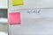 Word goals together with pink and yellow paper stickers attached to a flip chart