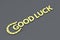 Word good luck with golden horseshoe on a gray background
