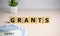 the word of GRANTS on building blocks concept