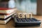Word of GST spelled with colorful wooden alphabet blocks.Selective focus,shallow depth of field