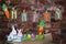 Word Happy on sackcloth tags hanging on a line with orange carrot, colorful Easter eggs, glass jar and easter bunny rabbit