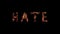 Word HATE burning on black background Steel wool smoldering Beautiful combustion Exciting typography font