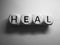 Word heal spelled on dice