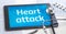 The word Heart attack on the display of a tablet