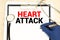 word Heart Attack on the paper plate with marker, Medical concept