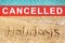 Word HOLIDAYS on beach sand, blue sea wave landscape, red CANCELLED stamp, Coronavirus pandemic, covid 19 epidemic, cancellation