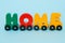 Word Home made of letters train cars alphabet. Bright colors of red yellow green and blue on a white background. Early childhood e