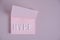 Word hype laid out white letters pink piece paper.Concept hype, popularity and fun.