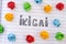 The word Ikigai on notebook sheet with some colorful crumpled paper balls around it