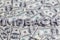 The word IMPEACH laid with aluminium letters on the US dollar banknotes background - with selective focus