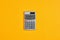 The word insurance on calculator display with yellow background. Calculating insurance costs or insurance return