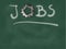 The word jobs with gear wheel on chalkboard