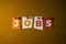 The word Jobs written on colorful note papers on board background. Employment concept. Job search