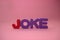 The word joke made of magnetic polystyrene letters