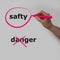 The word juice is circled with a pink pencil by a hand with a bubble, the word danger is crossed out