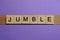 word jumble in small square wooden letters