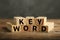 Word KEYWORD made of blocks on table, closeup