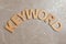 Word KEYWORD made of wooden letters on marble background, flat lay