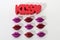 The word kiss and little red and purple lips