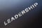 Word leadership spelled with chrome letters on aluminium background