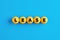 The word lease written on yellow balls in a row on blue background. Financial leasing