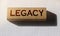 Word Legacy on Wooden building cubes with letters. Law business concept