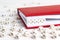 Word Loser written in wooden blocks in red notebook on white woo