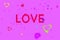 Word LOVE and Abstract motley hearts floating on pink  background.   Valentine`s Day Background