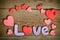 Word Love composition on the wooden board