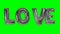 Word love from helium silver balloon letters floating on green screen -