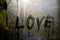 Word love on misted glass
