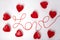 The word love and red hearts around the word. Romance. february 14 valentine's day