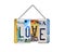 Word love written with recycled license plates