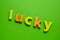 Word LUCKY on green background.Learning the English alphabet and language.The concept of child education, school, kindergarten