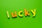 Word LUCKY on green background. Learning the English alphabet and language.The concept of education, school, kindergarten