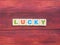 Word Lucky on wood