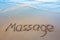 Word Massage written on the sand near the sea.Vacation concept.