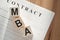 Word MBA - Master of Business Administration, on wooden cubes on contract documents background