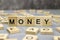 Word money made of wooden letters