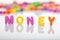 The word money with plastic letters