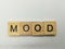 Word mood spelled on wooden tile