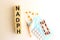 The word NADPH is made of wooden cubes on a white background. Medical concept