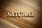 Word natural made with wooden letters