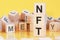 Word nft from wooden blocks with letters, concept