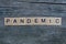 Word pandemic made from gray wooden letters