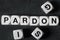 Word pardon on toy cubes