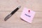 The word pause on pink sticky note