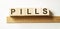 Word PILLS made with wood building blocks