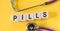 Word PILLS made with wood building blocks